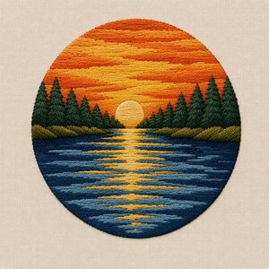 May include: Embroidered circular artwork depicting a sunset over a lake. The sky transitions from orange to yellow, with the sun reflecting on the water. Dark green trees line the horizon, and the lake is a mix of blue and yellow threads.