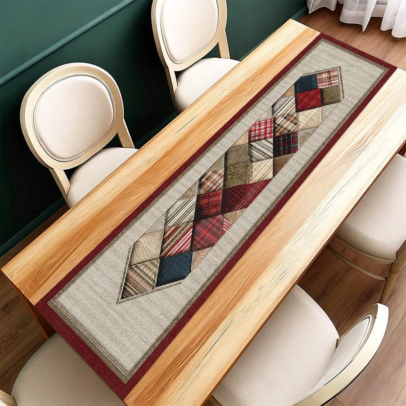 May include: A rectangular table runner with a geometric design. The runner features a central pattern of diamond-shaped patches in various colours and patterns, including red, blue, and beige. It is bordered by a dark red trim and a light beige background.