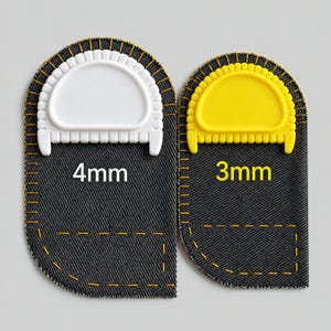 May include: Two dark gray denim fabric pieces with yellow stitched edges. The left piece features a white plastic semi-circular guide labeled 4mm, while the right piece has a yellow plastic semi-circular guide labeled 3mm. Both have rectangular stitched pockets.