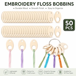 May include: Fifty light-colored wooden embroidery floss bobbins with oval shapes and circular cutouts. The set includes individual bobbins and a metal ring holding several bobbins threaded with pink, purple, green, blue, and orange embroidery floss.