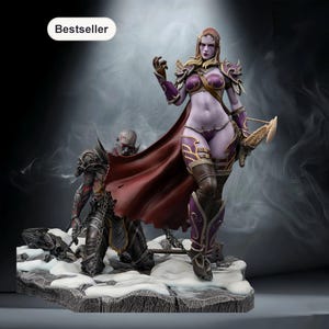 May include: A detailed figurine of a female fantasy character in purple armour, holding a bow, with a male figure in the background. The figurine is set on a snowy base, with a "Bestseller" label in the corner. The character has a red cape.