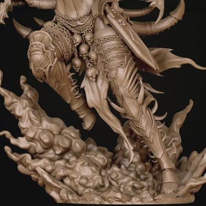 May include: A detailed sculpture of a fantasy figure in a dynamic pose. The figure is adorned with armour, chains, and skull accents. A large sword is visible, and the figure appears to be emerging from a cloud-like base. The colour is a neutral beige.