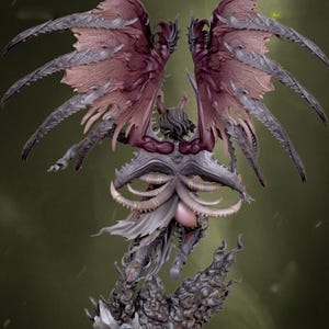 May include: A detailed figurine of a winged creature with a dark colour palette. The figure has large, intricate wings in shades of burgundy and grey. The sculpture features a complex design with horns and a flowing garment.