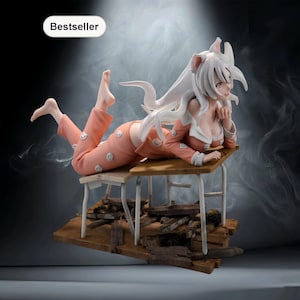 May include: A figurine of a character with long white hair and cat ears, wearing a peach-colored pajama set with smiling face graphics. The figure is posed on a miniature desk and chair set, with a wooden base. The word "Bestseller" is in the top left corner.
