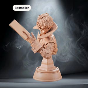 May include: A tan-colored bust of a character holding a rectangular object, possibly a book or tablet. The figure has detailed hair and clothing, with a high collar and buttoned sleeves. The base is round with a tiered design. The word "Bestseller" is in a white oval.