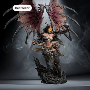 May include: A detailed figurine of a female demon with large, textured wings. The figure is clad in armour and holds a weapon, with a menacing expression. The figurine is on a rocky base, with the word "Bestseller" in a white box.