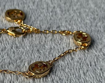 Pulseira GG artesanal reciclada com corrente dourada