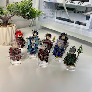 K&ouml;nnte beinhalten: Eine Sammlung von Acryl-Charakterfiguren, jede mit einem einzigartigen Design und Farbschema. Die Figuren stehen auf transparenten Sockeln und zeigen detaillierte Kunstwerke und lebendige Farben. Die Figuren scheinen aus einem Videospiel oder Anime zu stammen.
