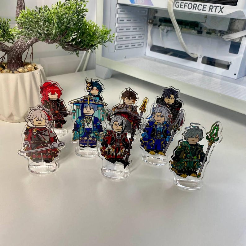 K&ouml;nnte beinhalten: Eine Sammlung von Acryl-Charakterfiguren, jede mit einem einzigartigen Design und Farbschema. Die Figuren stehen auf transparenten Sockeln und zeigen detaillierte Kunstwerke und lebendige Farben. Die Figuren scheinen aus einem Videospiel oder Anime zu stammen.