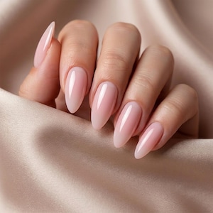 May include: Five almond-shaped fingernails featuring a glossy, sheer light pink polish. The nails are neatly manicured with a smooth, reflective finish, showcasing a clean and uniform appearance across all visible fingers.