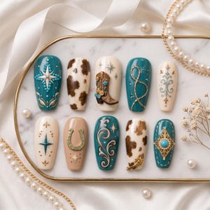 May include: A set of ten press-on nails featuring a variety of designs including teal backgrounds with starbursts, brown and white cow print patterns, a three-dimensional cowboy boot, a golden horseshoe, intricate scrollwork, and turquoise accents.