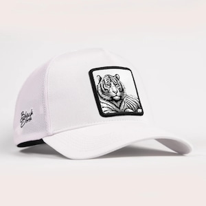 May include: A white baseball cap featuring a mesh back and a black and white rectangular patch on the front panel. The patch displays a detailed illustration of a tiger. The text Black Dark is embroidered in black on the side of the cap.