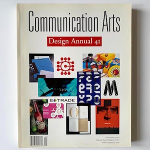 Op de afbeelding: Een magazinecover voor Communication Arts Design Annual 41. De cover toont een collage van designelementen, waaronder een rood logo, een fles en de tekst "EXTRADE". Het tijdschrift is gedateerd november 2000.