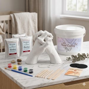 May include: A 3D hand casting kit with a white plaster hand sculpture. The kit includes bags of gypsum powder, paint pots, a paintbrush, stirring sticks, and a container labelled "3D Hand Casting Kit".