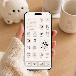 May include: A smartphone screen displaying a custom interface with a light beige background and hand-drawn black line art icons. The layout includes a calendar for August, various app icons labeled with text, and a large central sun illustration.