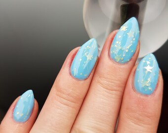 Crossed Wands - custom handcrafted witchcraft and wizardry sky blue gold holographic star glitter nail polish