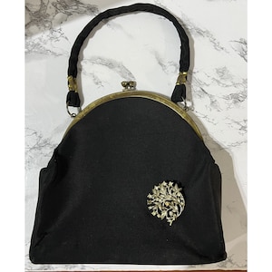 Monedero vintage Julius Resnick JR USA de tela negra