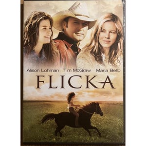 May include: DVD case for the film Flicka. The cover shows Alison Lohman, Tim McGraw, and Maria Bello, with a girl riding a horse in a field. The title "Flicka" is displayed in large letters.