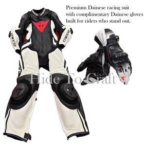 May include: Black, white, and red Dainese racing suit with matching gloves. The suit features a black leather base with white and red accents, knee and elbow protectors, and Dainese branding. The gloves are black and white with red details.