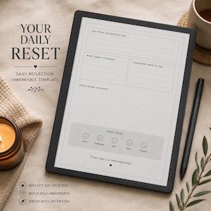 Op de afbeelding: Een zwarte digitale tablet met een dagelijks reflectiesjabloon genaamd Your Daily Reset. Het scherm bevat secties voor dankbaarheid, gedachten en gevoelens, plus een stemmingsschaal en de tekst Every day is a new beginning.