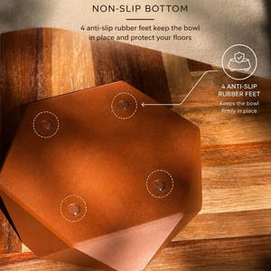 May include: A brown, geometric bowl with a non-slip base. The text "STABLE & SECURE" and "NON-SLIP BOTTOM" are visible. The bowl has four anti-slip rubber feet to keep it in place. The text "4 ANTI-SLIP RUBBER FEET Keeps the bowl firmly in place" is also visible.