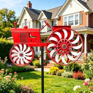 May include: A red metal tractor garden ornament with white detailing on the wheels. The tractor is mounted on a black pole, set in a garden with a house in the background. The wheels have a diameter of approximately 61 cm.
