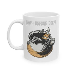 May include: A set of three ceramic mugs with a speckled, matte finish. The mugs are in shades of cream, light gray, and dark gray. Each mug has a simple, minimalist design and a rounded handle.