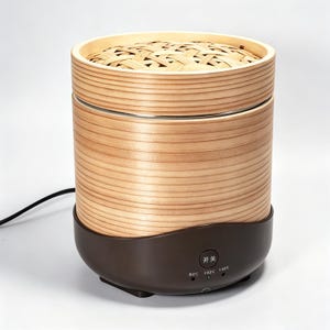 May include: A cylindrical electric food steamer with a light wood grain exterior and a woven bamboo lid. The base is dark brown with a circular power button labelled with Chinese characters and three temperature settings: 80C, 100C, and 120C.