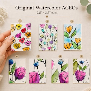 May include: A collection of seven original watercolor ACEO art cards, each measuring 2.5" x 3.5". The cards feature colorful floral designs with black outlines. The color palette includes yellow, pink, orange, blue, and purple. The text "Original Watercolor ACEOs" is at the top.