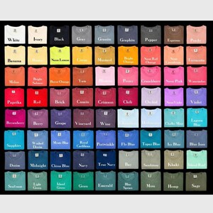 May include: A display of t-shirts in a variety of colours, each with a label indicating its shade. The colours range from white and black to vibrant reds, blues, and greens. The shirts are arranged in a grid, offering a wide selection.