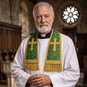 May include: A man wearing a white clerical shirt with a black collar and a green and gold stole with gold fringe and a gold cross design. The background shows a church interior with a stained glass window.