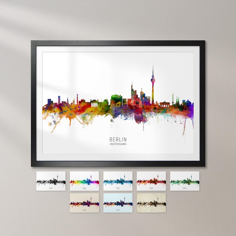 a framed watercolor painting of the Berlin skyline, with various color variations of the cityscape displayed on the poster.