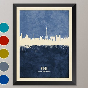 May include: A watercolor-style illustration of the Paris skyline in white against a blue background. The Eiffel Tower is the most prominent feature, with other landmarks like the Arc de Triomphe and Notre Dame Cathedral visible. The text "PARIS - FRANCE" is printed below the skyline.