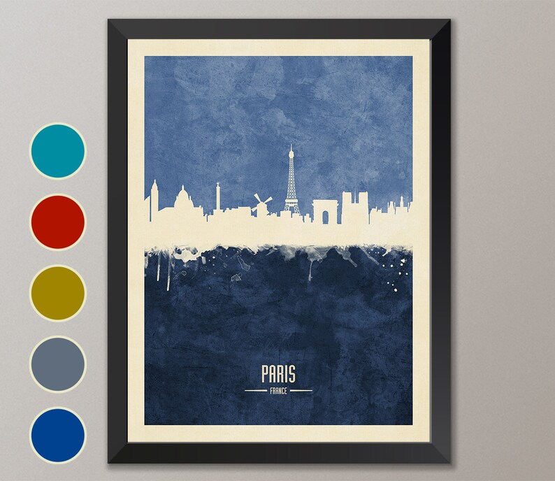 May include: A watercolor-style illustration of the Paris skyline in white against a blue background. The Eiffel Tower is the most prominent feature, with other landmarks like the Arc de Triomphe and Notre Dame Cathedral visible. The text "PARIS - FRANCE" is printed below the skyline.