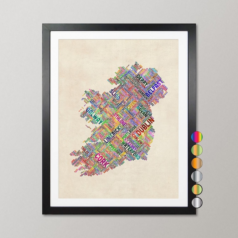 The image is a framed artwork depicting a colorful map of Ireland, with the country's name written in various colors across the map.
