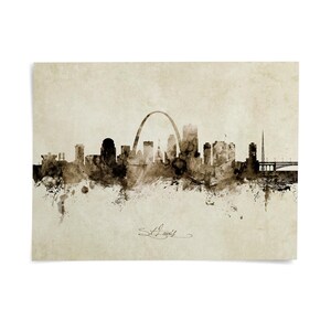 a city skyline, featuring a large arch structure and various other buildings.