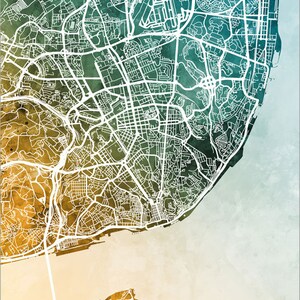 May include: A detailed map of Lisbon, Portugal, with white lines outlining the streets and roads. The map is overlaid on a watercolor background with shades of green, blue, and yellow.