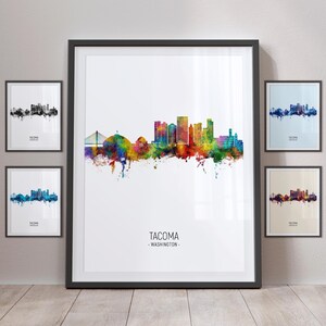 May include: A colorful watercolor illustration of the Tacoma, Washington skyline. The skyline is depicted in a vibrant rainbow of colors, with the city's iconic buildings and bridges visible. The text "TACOMA - WASHINGTON -" is printed below the skyline.