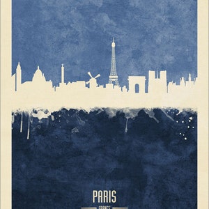 May include: A watercolor-style illustration of the Paris skyline, featuring the Eiffel Tower, the Arc de Triomphe, and other iconic landmarks. The background is a deep blue color with white splatters of paint. The text "PARIS - FRANCE" is printed below the skyline.
