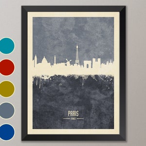 May include: A watercolor-style illustration of the Paris skyline in white against a blue background. The Eiffel Tower is the most prominent feature, with other landmarks like the Arc de Triomphe and Sacr&eacute;-C&oelig;ur Basilica visible. The text "PARIS - FRANCE" is printed below the skyline.