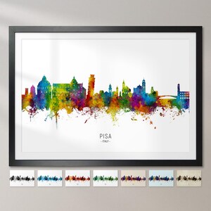 Può includere: Un acquerello della città di Pisa, Italia. Lo skyline presenta l'iconica Torre Pendente di Pisa e altri edifici in un vibrante arcobaleno di colori.