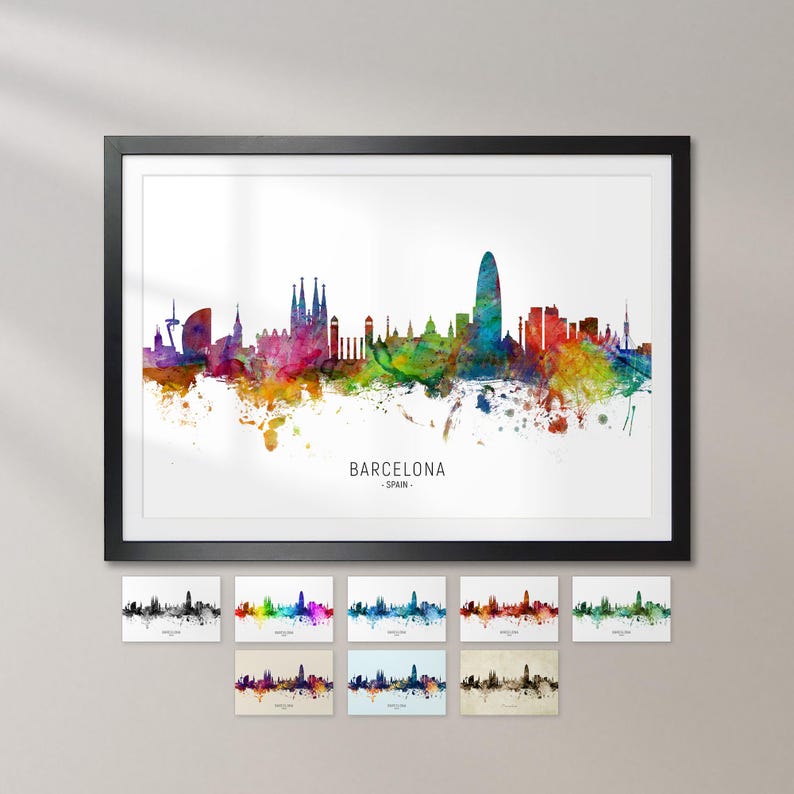a framed watercolor painting of the Barcelona skyline, with various colored splashes representing the city's landmarks and architecture.