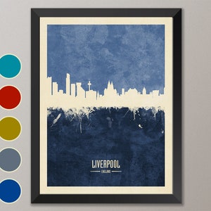 May include: A blue and white watercolor cityscape print of Liverpool, England. The skyline is white against a blue background with white paint splatters.