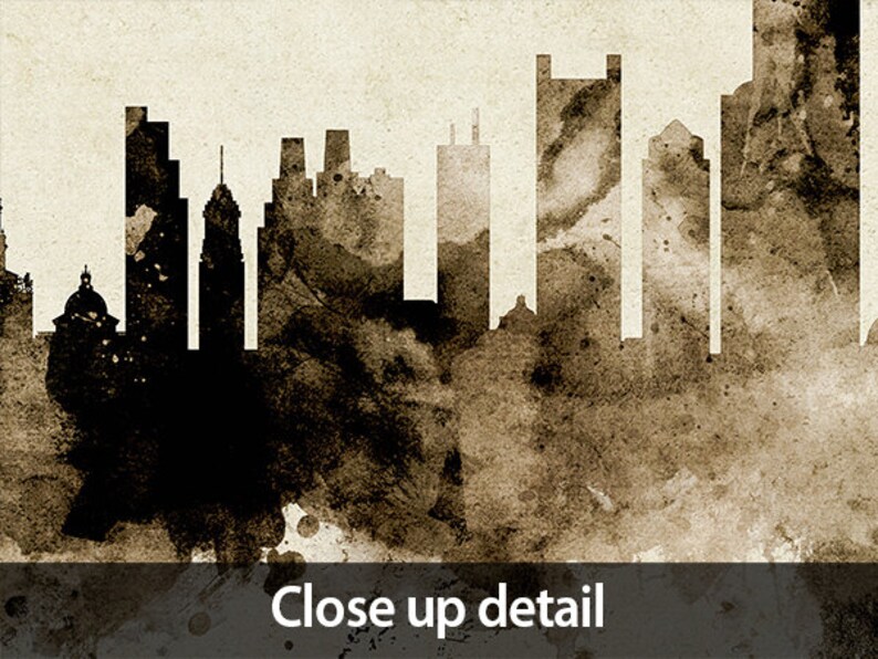 May include: A black and white silhouette of a city skyline with a brown watercolor background. The skyline features tall buildings and a church steeple.