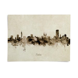 A black and white watercolor-style illustration depicting the skyline of a city, with various buildings and structures depicted in a loose, abstract manner.
