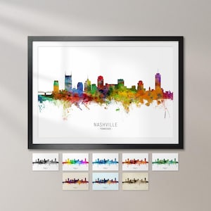 The image is a framed watercolor painting of the Nashville skyline, featuring a colorful and abstract representation of the city's buildings and landmarks.