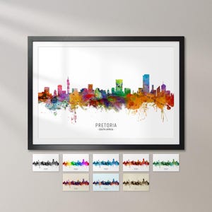 The image is a framed watercolor painting depicting the Pretoria skyline of South Africa.