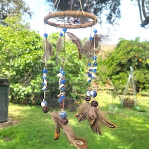 Feathered mobile with sodalite and shell