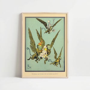 May include: A framed vintage illustration from The Wizard of Oz, featuring winged monkeys carrying Dorothy and a skeleton figure. The artwork has a light green background and a cream-colored frame. The text at the bottom reads, "The Monkeys caught Dorothy in their arms and flew away with her."
