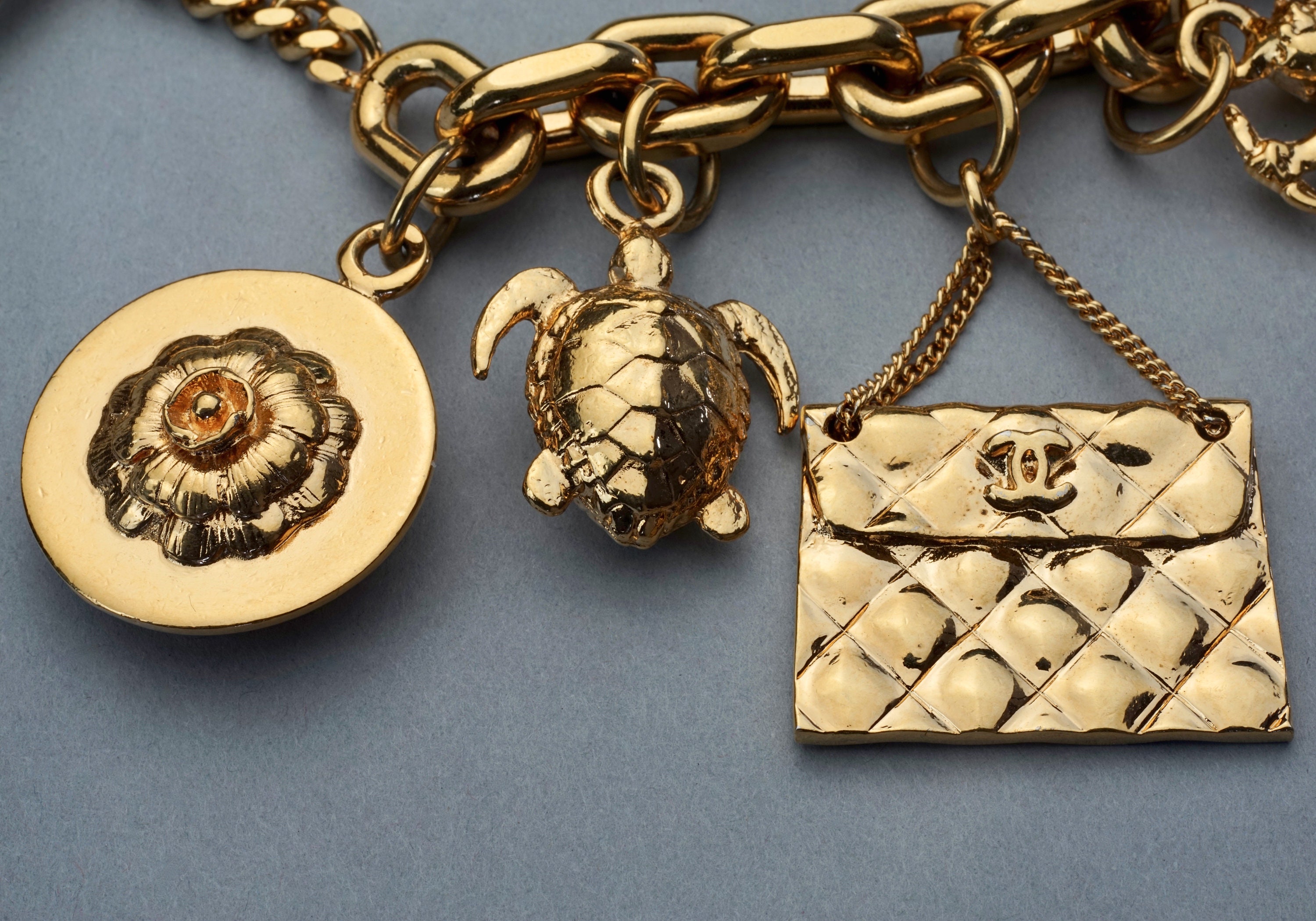 Chanel Designer Heavy Gilt 7 Charm coco Bracelet